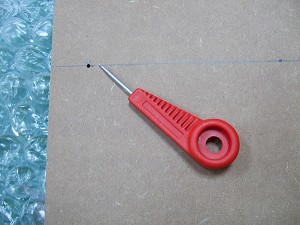 Use a bradawl to punch holes through the MDF